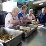 people helping with meals