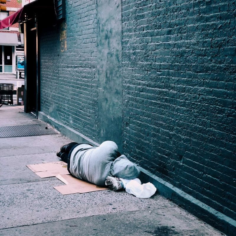 Man sleeping in an alley