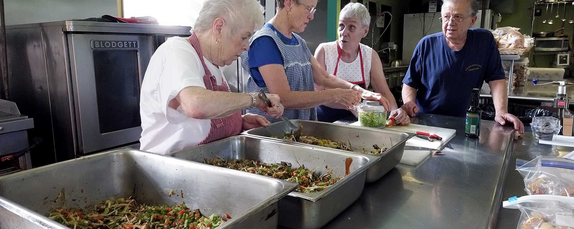 people helping with meals