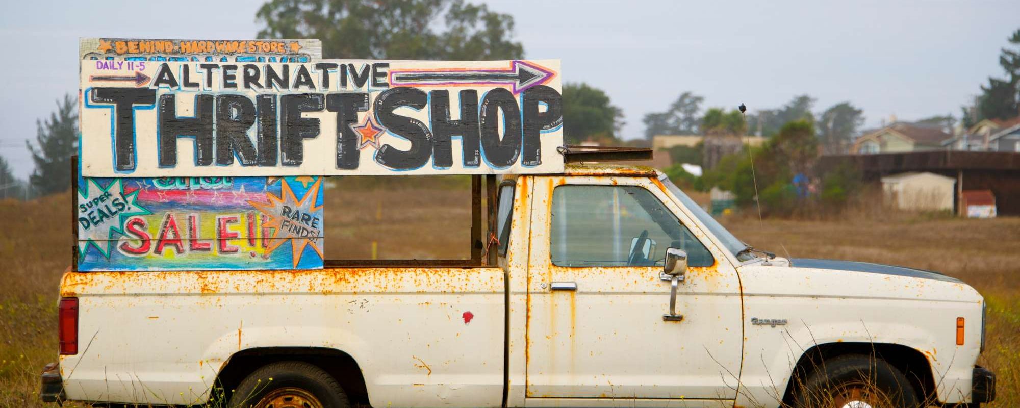 A truck that reads "alternative thrift shop"