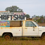 A truck that reads "alternative thrift shop"