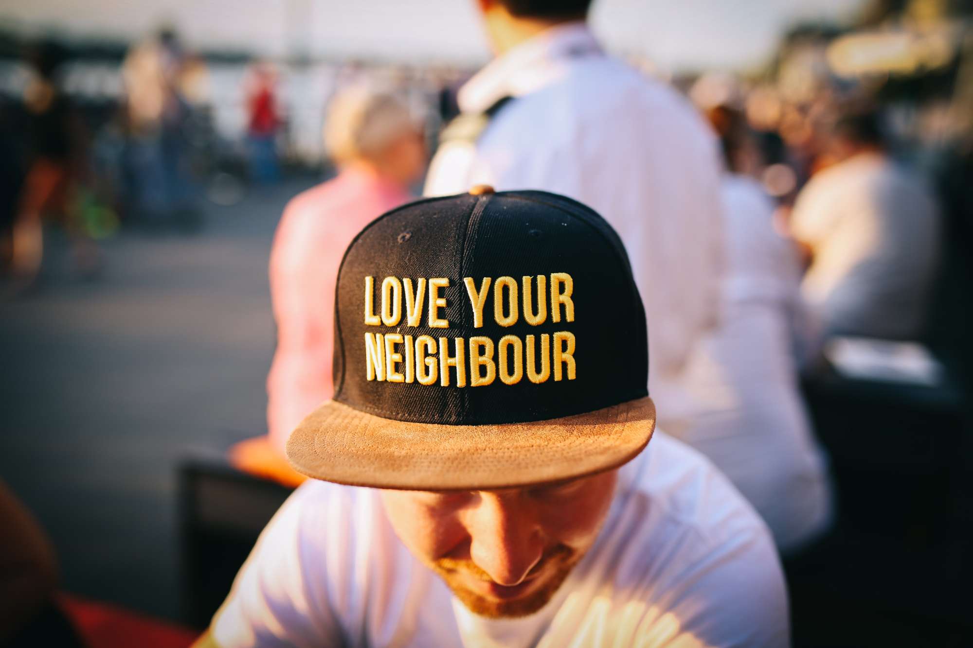 A hat that says, "love your neighbor"