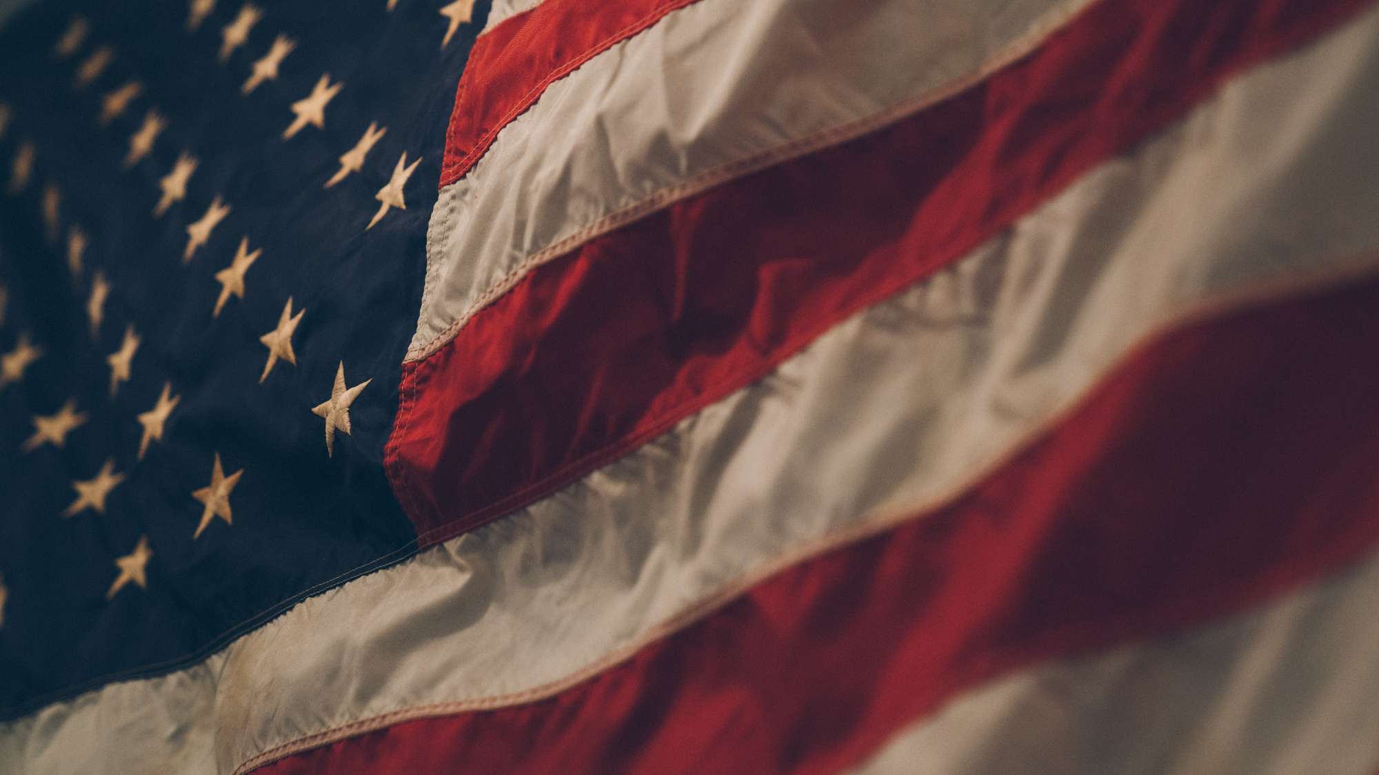 A close-up photograph of the American flag.