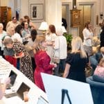 Guests check in and mingle at "Together for Women"
