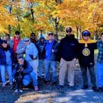 Grace Center clients and staff pose for the camera outside Russell Orchards