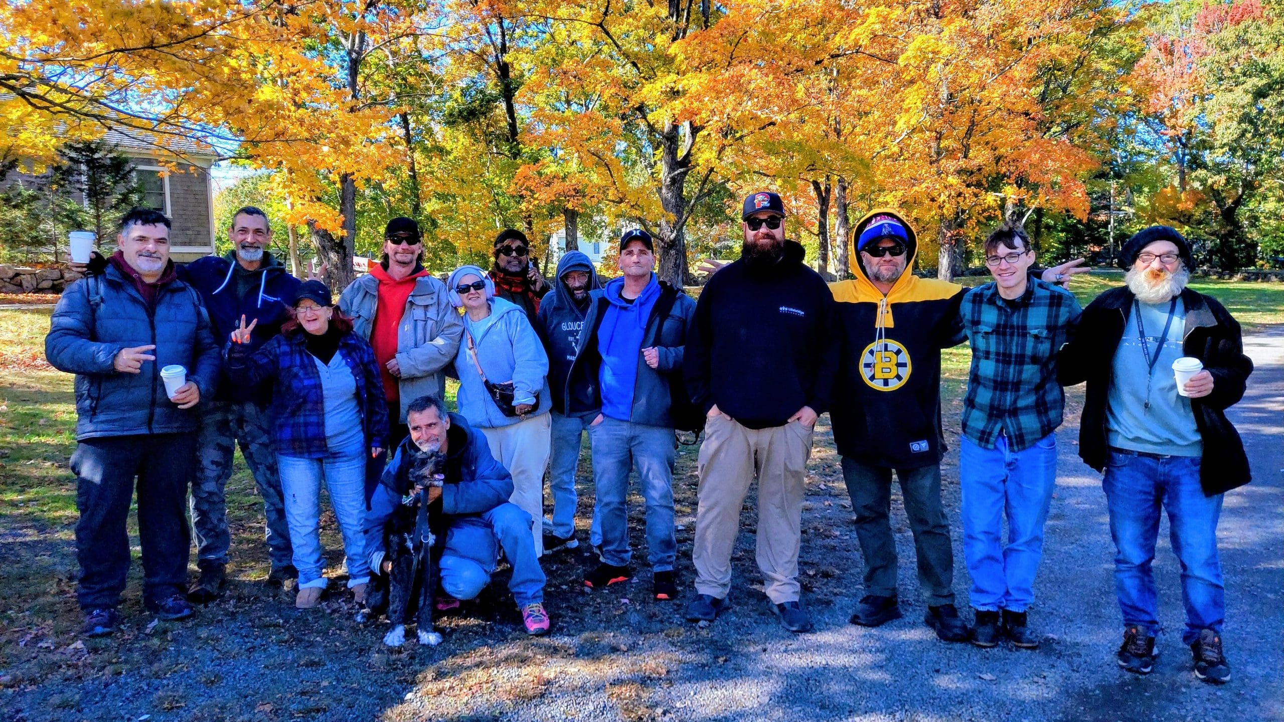 Grace Center clients and staff pose for the camera outside Russell Orchards