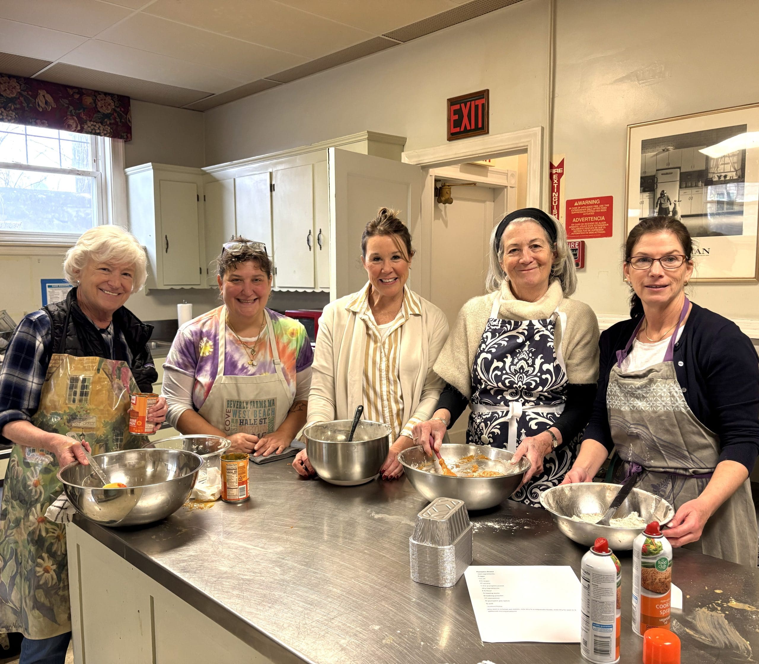 Lifebridge volunteers bake breads in the kitchen at 35 Conant St., Beverly in preparation for their biannual giving day event, the Lifebridge Backpack Program last November