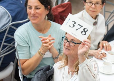Guest making a bid at auction