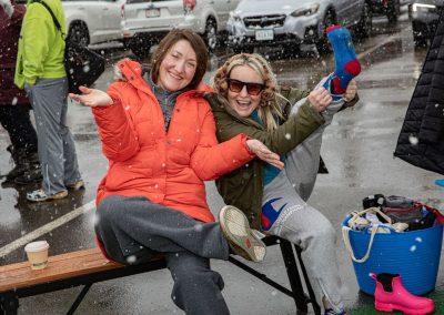 Two women waiting for the sauna smiling and posing for the camera.