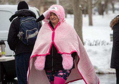 Woman wrapped in a pink flamingo towel.
