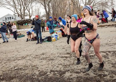 Participants running into the water.